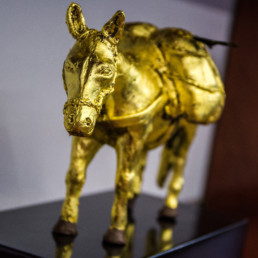 Close-up on work of art ''Chocolate Mule'', a chocolate and gold sculpture by artist Santiago Montoya. From the exhibition at Espacio El Dorado ''Missteps and other paths'' during ArtBo 2017.