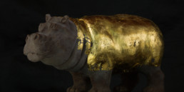Work of art ''Hippopotamus'', a chocolate and gold sculpture by artist Santiago Montoya. The hippopotamus has his body covered in gold. From the exhibition at Espacio El Dorado ''Missteps and other paths''.