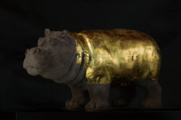 Work of art ''Hippopotamus'', a chocolate and gold sculpture by artist Santiago Montoya. The hippopotamus has his body covered in gold. From the exhibition at Espacio El Dorado ''Missteps and other paths''.