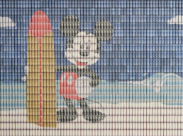 Close-up on work of art ''Surfin'USA''. Mickey's and his surfboard made with paper money by artist Santiago Montoya.
